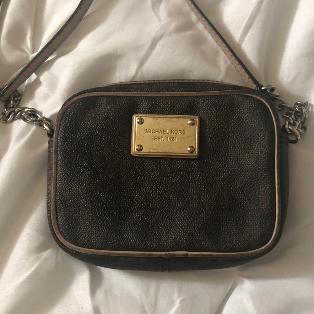A brown Michael Kors purse